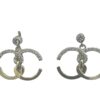 two half-circle diamond earrings